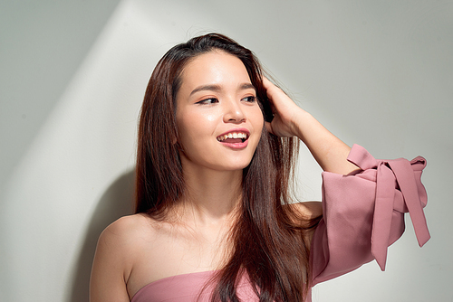 Portrait of a pretty woman smiling in sunlight