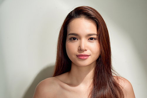 Beauty sunshine girl portrait. Pretty happy woman enjoying summer outdoors in bright Sunny day