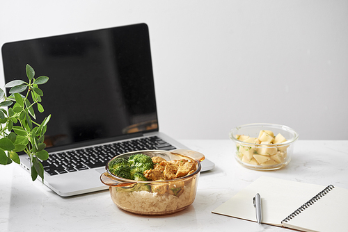 chicken with soy sauce and a . and a laptop for work