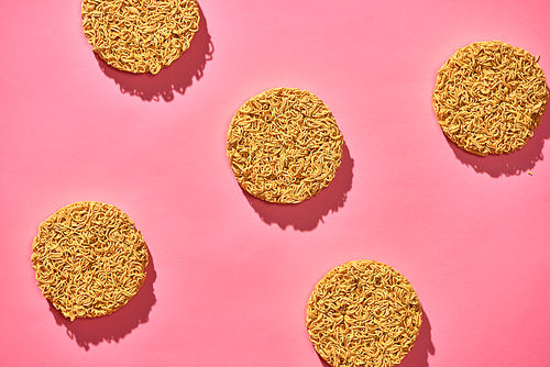 dry instant noodle isolated on pink background