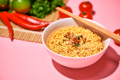 A Bowl of instant noodles on wooden table