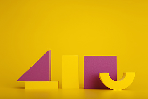 Minimalistic abstract duotone still life with yellow and purple geometric figures against yellow background with space for text