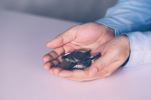 Hands of businessman holding money with coin, investment and profit, fund and growth about finance, economy and financial, planning saving, accounting for success and income, business concept.