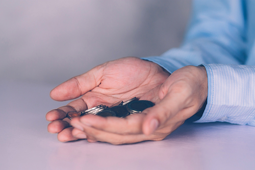 Hands of businessman holding money with coin, investment and profit, fund and growth about finance, economy and financial, planning saving, accounting for success and income, business concept.