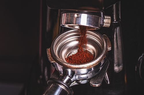 Close up of coffee grinding process