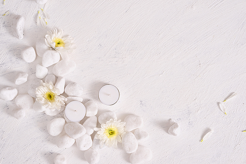 Spa setting with white flower ,candle on stone table