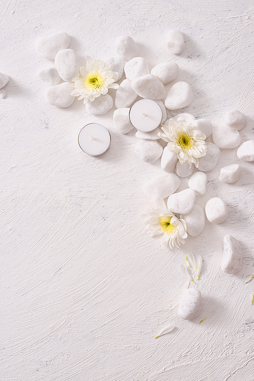 Spa setting with white flower ,candle on stone table