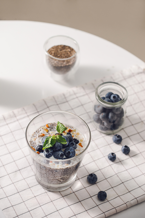 Chia pudding with fresh berries and almond milk. Superfood concept. Vegan, vegetarian and healthy eating diet with organic products