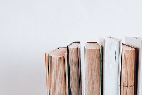 Stack of old book education concept background, many books piles with copy space for text, Book tops, Old and used hardcover books, top view. Educational concept. Close up