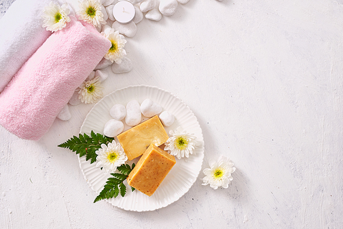 close up of body care cosmetic products on stone table