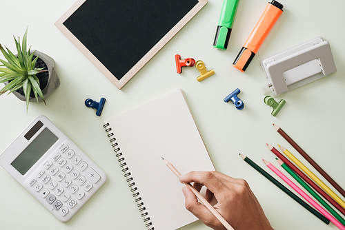 Office workplace - empty notepad, pen, pencil, ruler, compass on dark wooden background