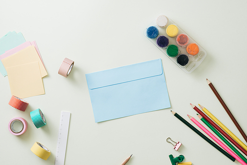 Colored pencils, paper clips and note pad, School supplies, Back to school, School and office supplies