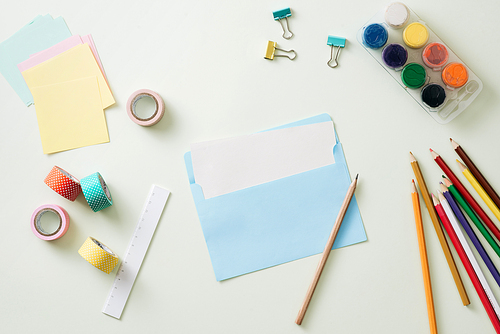 Colored pencils, paper clips and note pad, School supplies, Back to school, School and office supplies