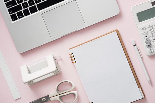 blank notebook with laptop and Office supply collection on desk