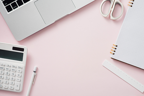 blank notebook with laptop and Office supply collection on desk