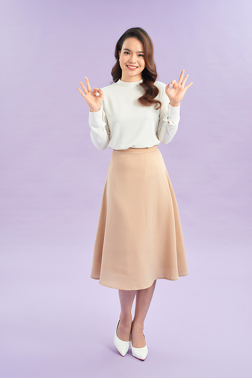 cheerful girl showing double ok-sign gesture with two hands