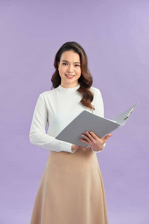 Asian business woman holding open folder with document