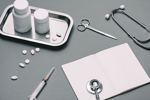 Doctor desk table with stethoscope and medical items. Flat lay.