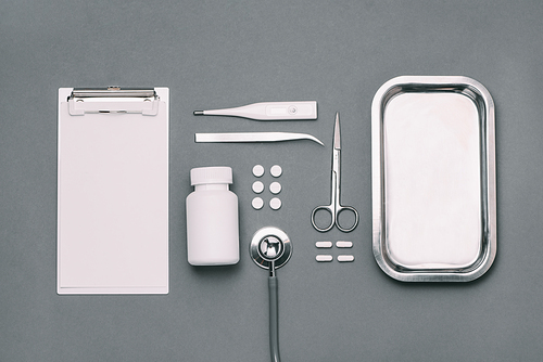 Top view of doctor desk table with stethoscope and medical items. Flat lay.