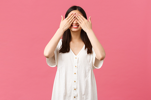 Beauty, people emotions and summer leisure and vacation concept. Cute and excited asian birthday girl celebrating at party, waiting for surprise with shut eyes, standing blindfolded happy.