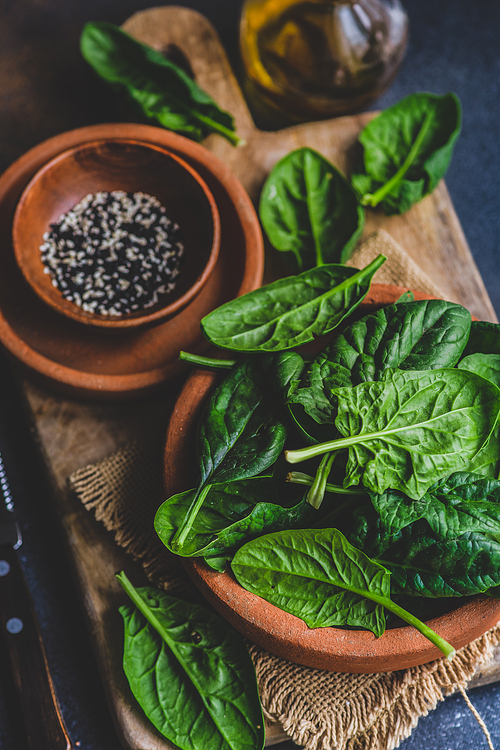 Organic food concept with fresh baby spinach leaves for healthy salad cooking