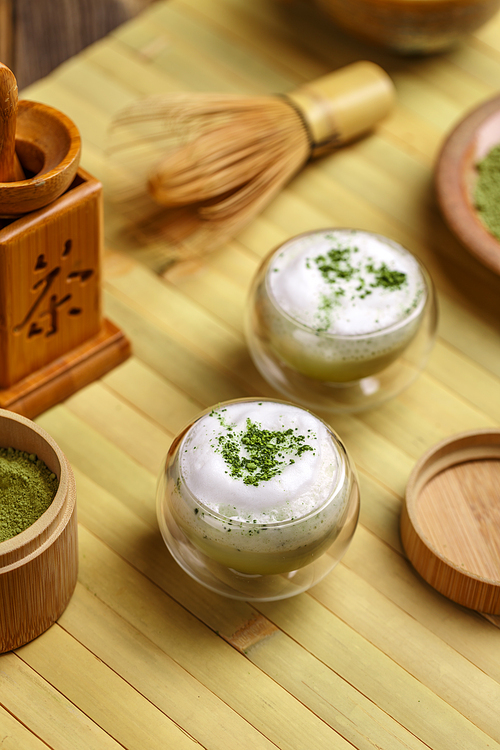 Matcha green tea latte in small glass bowl