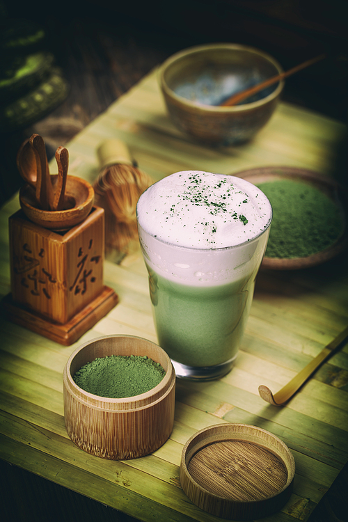 Green tea matcha latte in a glass cup