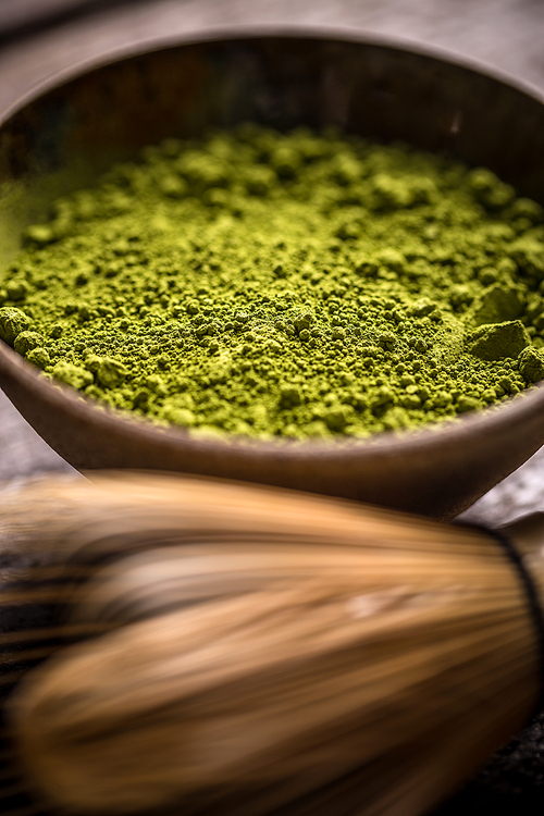 Raw organic green matcha tea in a bowl