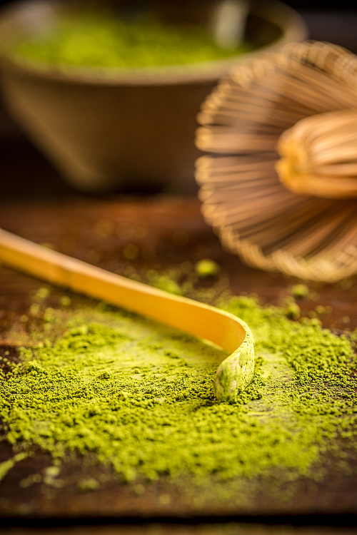 Matcha green tea powder with spoon