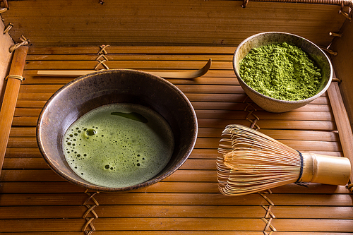 Organic green matcha tea in a bowl