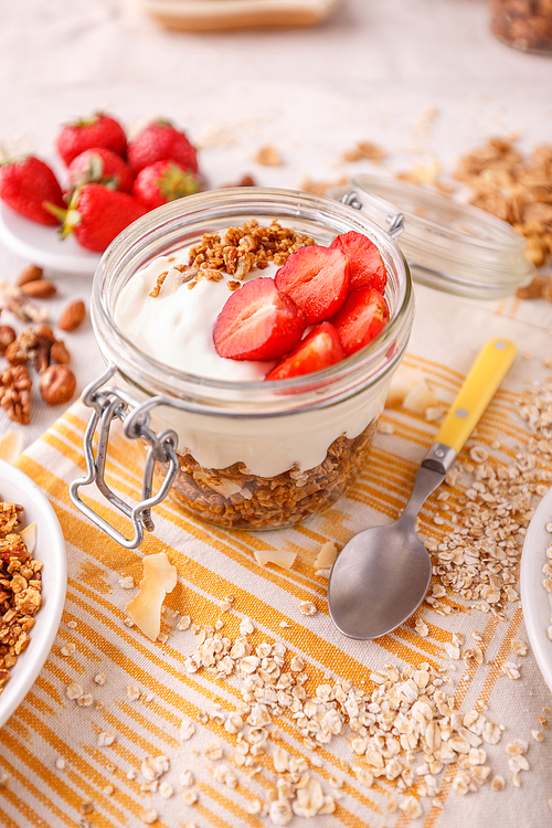 Homemade granola with yogurt and fresh strawberries  for healthy breakfast