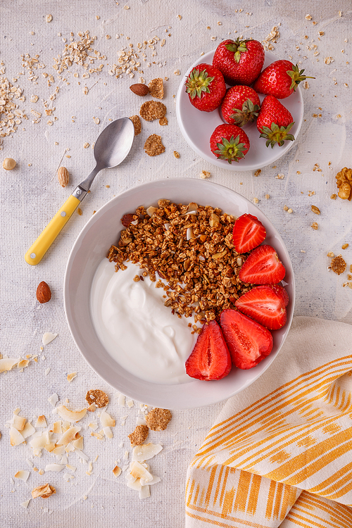 Morning granola breakfast served with Greek yoghurt and fresh fruit