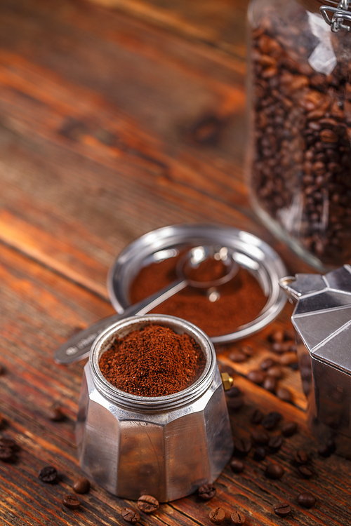 Old coffee maker filled with ground coffee