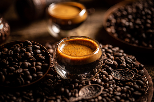 Cup of black coffee and beans, coffee still life