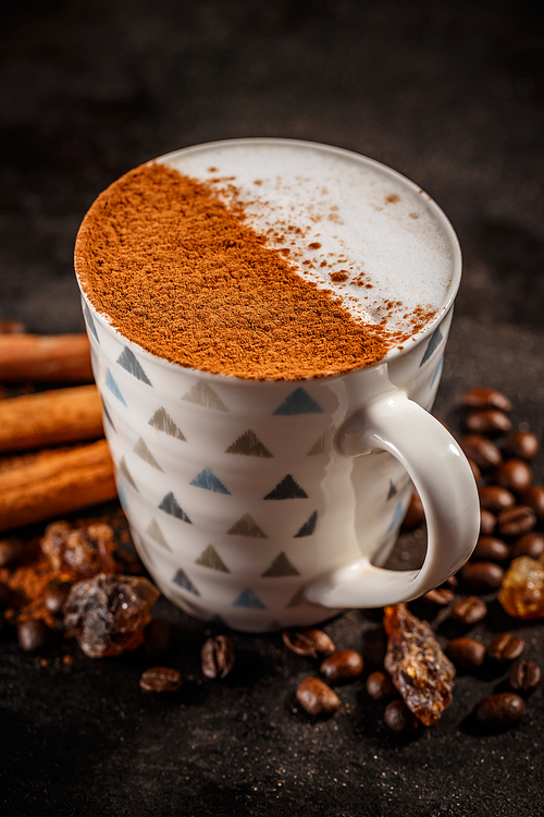 Winter warm spice coffee drink on vintage dark background