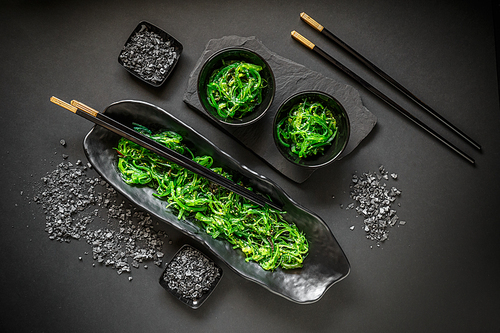 Traditional Japanese Chuka seaweed salad on black background