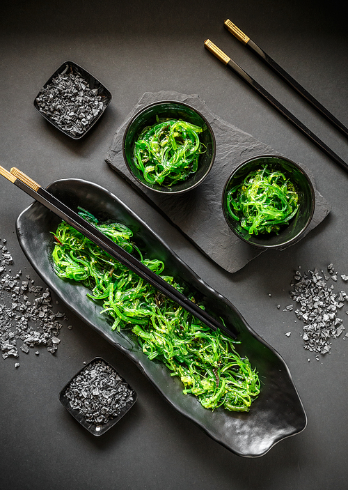 Top view of seaweed salad in bowl on black background , Japanese food