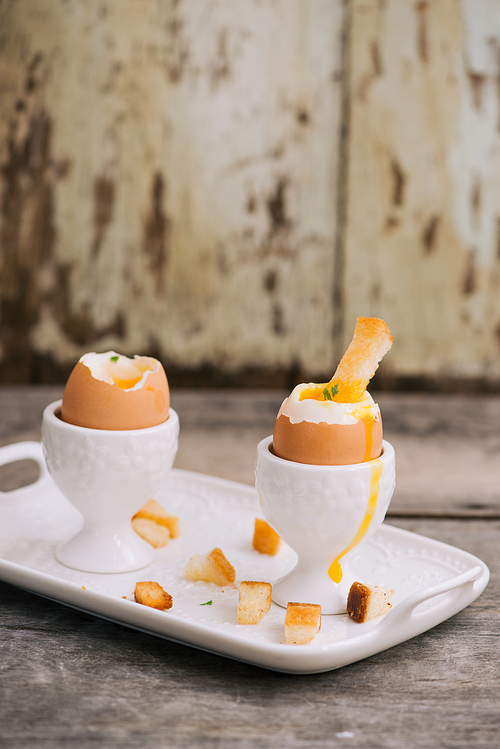 boiled eggs for breakfast on a old wooden table