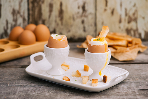 boiled eggs for breakfast on a old wooden table