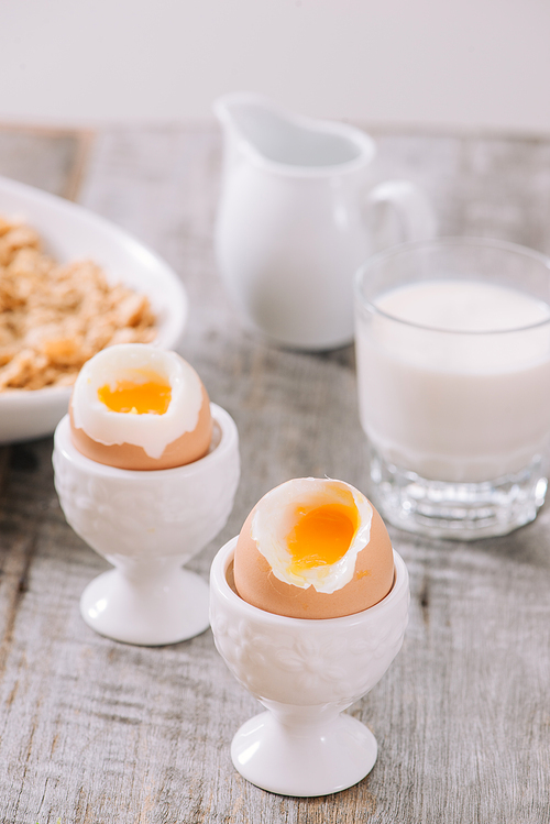 delicious breakfast with boiled eggs and crispy toasts, horizontal, closeup