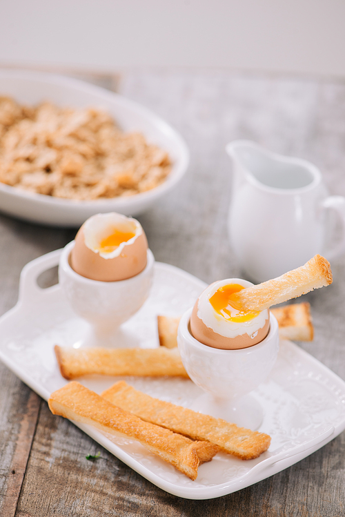 Soft boiled eggs with toast. Healthy fitness breakfast.