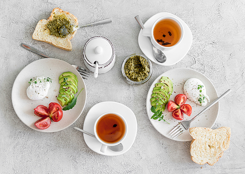 healthy breakfast: poached eggs, vegetables and tea