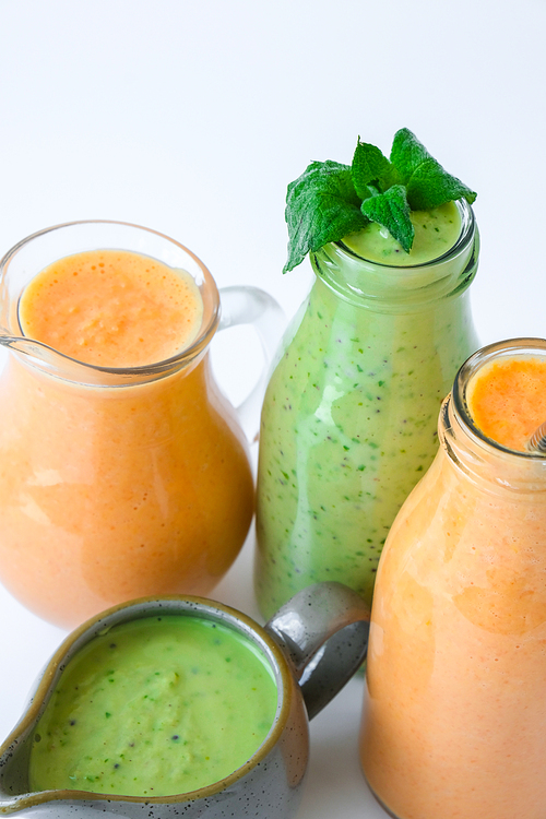 Seasonal Matcha green vegan smoothie with chia seeds and mint pumpkin carrot smoothie drink detox Breakfast. Clean eating, weight loss, healthy dieting food concept Fruit vegetable drink fitness