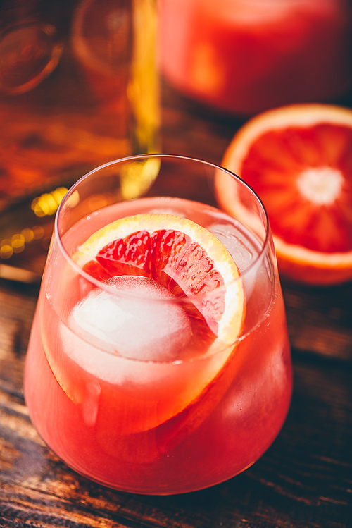 Whiskey sour cocktail with aged bourbon, blood orange juice and simple syrup