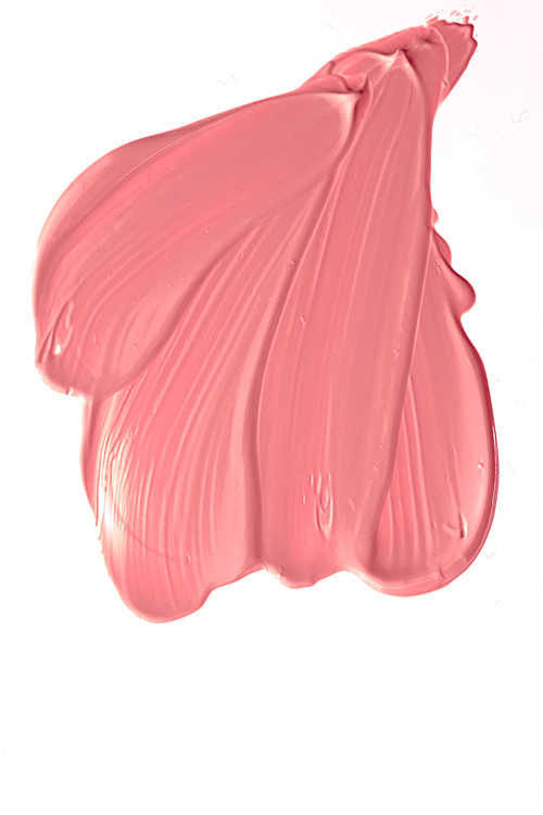 Coral beauty cosmetic texture isolated on white background, smudged makeup emulsion cream smear or foundation smudge, crushed cosmetics product and paint strokes.