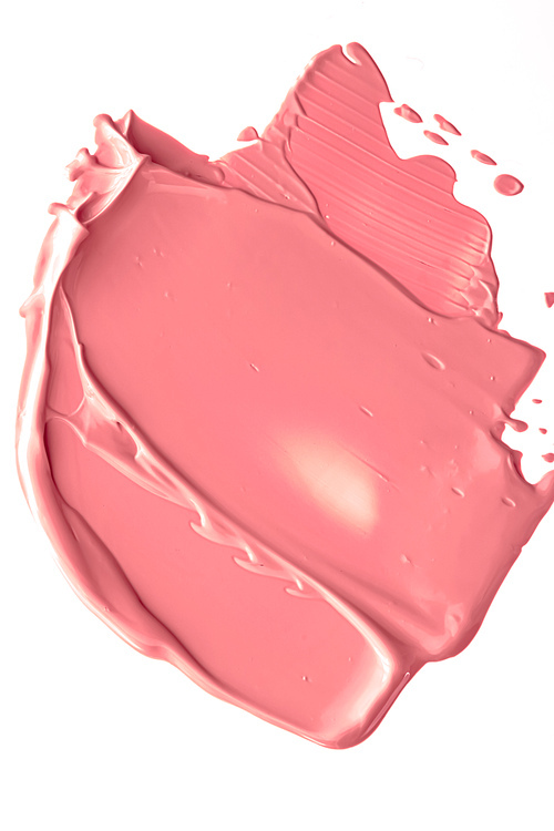 Coral beauty cosmetic texture isolated on white background, smudged makeup emulsion cream smear or foundation smudge, crushed cosmetics product and paint strokes.