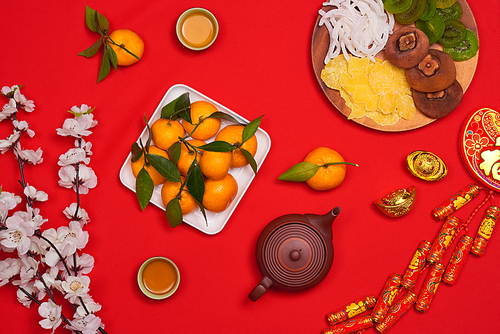 Flat lay Chinese new year new year table top shot. Toddler stealing food from table.