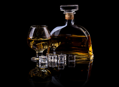 Brandy in large round glass and bottle