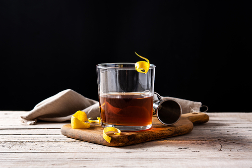 New Orleans sazerac cocktail on wooden table