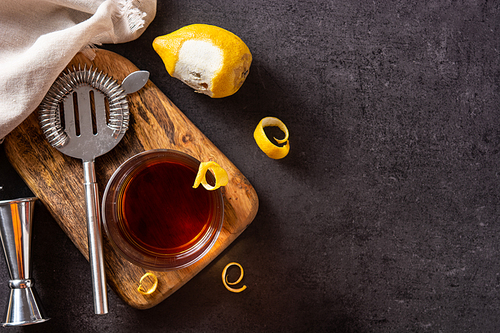 New Orleans sazerac cocktail on black slate background